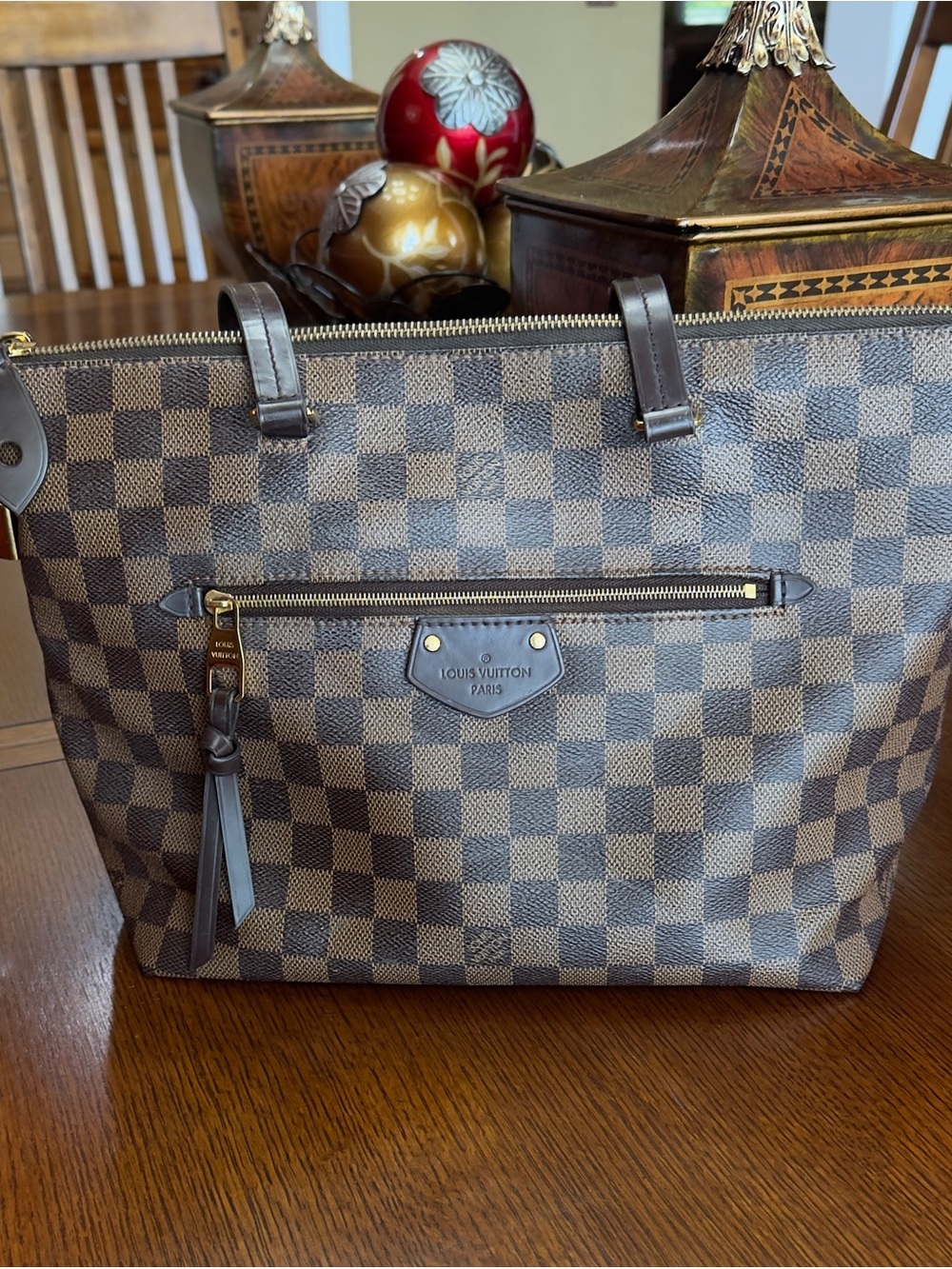 Louis Vuitton Iéna tote in Damier Ebene canvas.